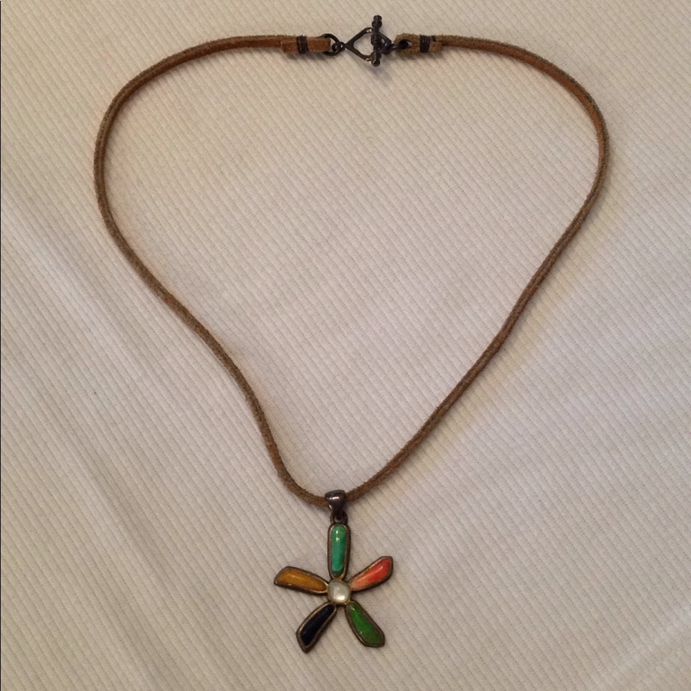 Sterling silver flower pendant on leather necklace